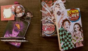 Mangá Demon Slayer: Kimetsu no Yaiba volumes 22 e 23, das minhas leituras de dezembro de 2025.
